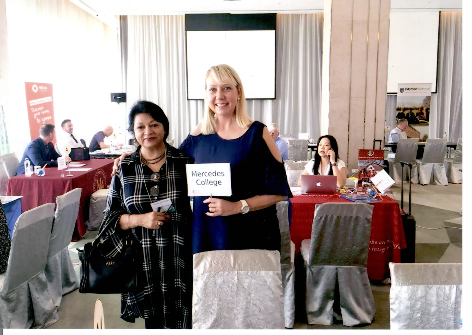 Our director with a Mercedes College representative at an international education fair